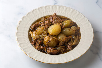 From Turkish cuisine; Onion stew with entrecote. Turkish name; Antrikotlu yogan guvec or yahni
