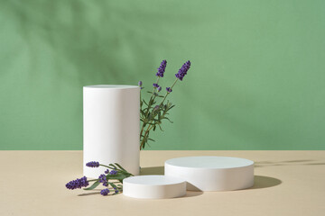 Fresh lavender flowers displayed with a set of three podiums. Podiums with empty space for organic...