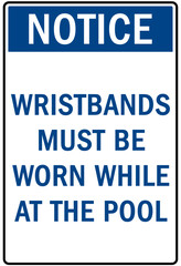 Pool pass required sign and labels wristbands must be worn while at the pool