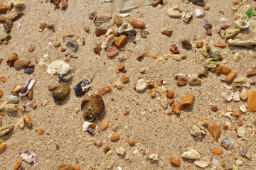 Fototapeta na wymiar Close up brown sand beach and stone with water sea in Thailand, summer, ocean, landscape, beautiful, sunrise, seascape, island, wallpaper