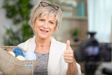 senior woman turned knitting hobby into teaching by online