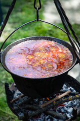 boiling chili con carne in a cauldron