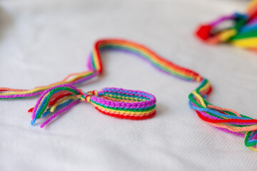 handmade crocheted rainbow bracelets as symbol of pride month isolated on white background
