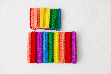 handmade crocheted rainbow bracelets as symbol of pride month isolated on white background