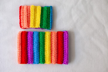 handmade crocheted rainbow bracelets as symbol of pride month isolated on white background