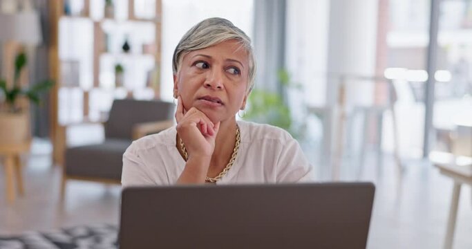 Thinking, planning and woman in office with laptop, research and ideas for proposal or project for business. Brainstorming, focus and mature businesswoman problem solving and working on online report