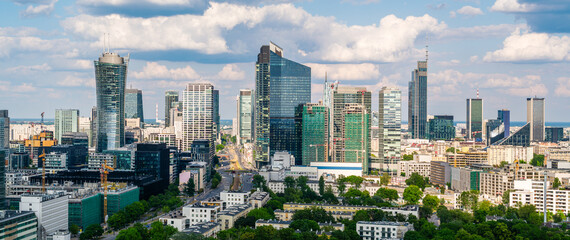 Warsaw city center aerial landscape, skyscrapers panorama under blue cloudy sky - obrazy, fototapety, plakaty