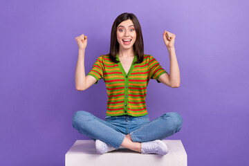 Full length photo of overjoyed cheerful lady wear trendy clothes sit podium rejoice win lottery...
