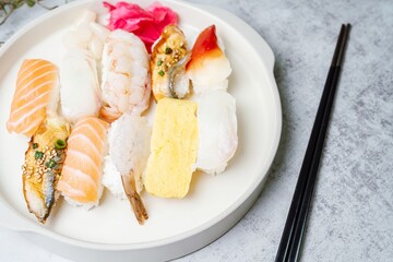 Fresh Japanese food sushi dishes on white plates