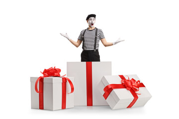 Mime coming out from a big gift box