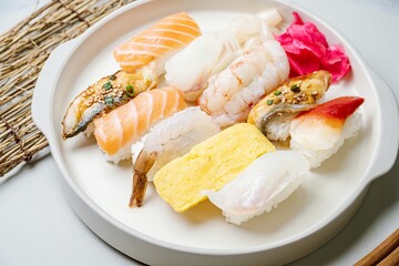 Fresh Japanese food sushi dishes on white plates