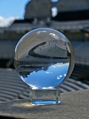 Orange, May 2023 : Visit the beautiful city of Orangeen Provence - Historical city with its arena and ancient theater - View on the theater Through a lens ball