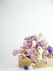 Bouquet of various flowers on a light background.