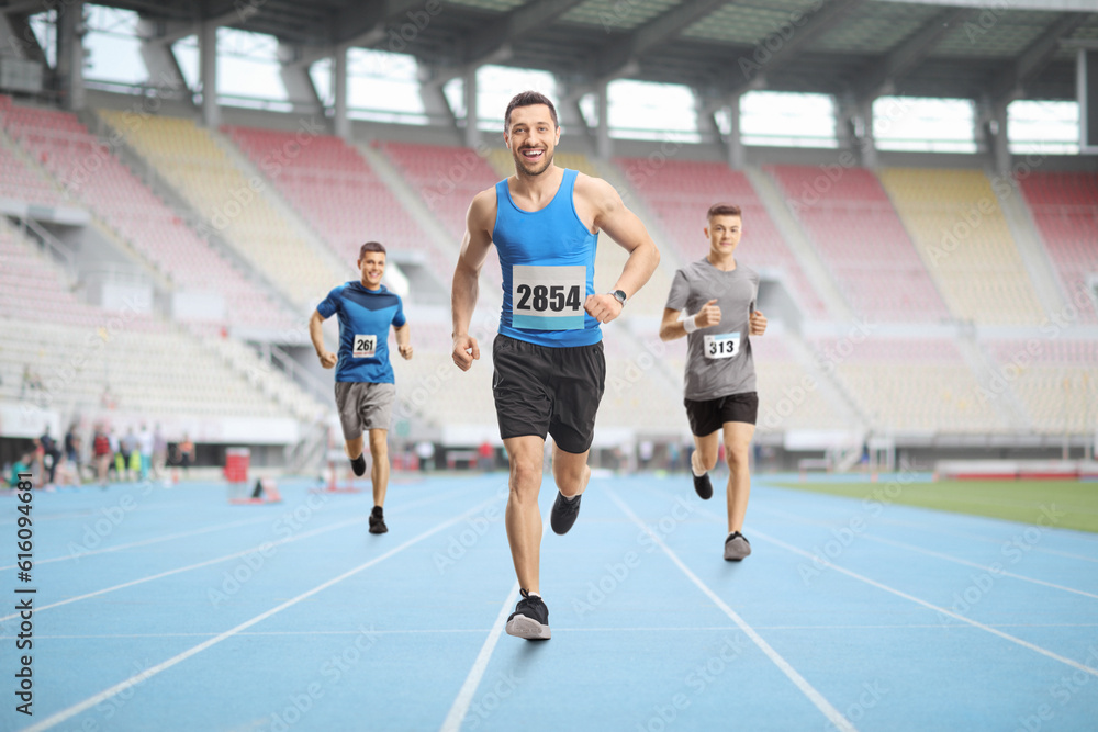 Canvas Prints men running a race at a stadium