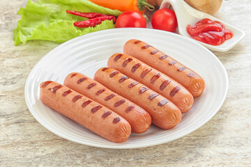 Grilled sausages with tomato sauce