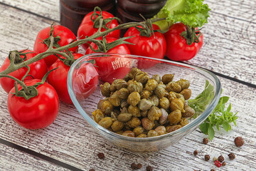 Marinated green capers in the bowl
