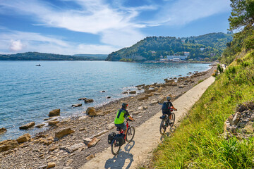 active senior couple on a mountain bike tour at Capodistria, Slovenian Mediterranen cost near Izola...