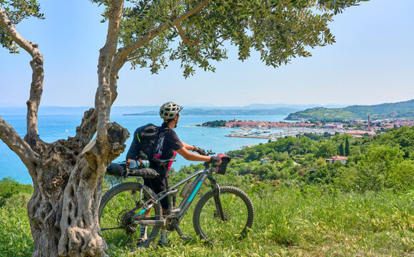 nice active senior woman on a mountain bike tour at the Slovenian Mediterranen cost above Izola