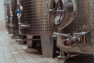 Modern wine distillery and brewery with brew kettles pipes and stainless steel tanks