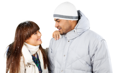 Happy young skiers couple embracing isolated on background