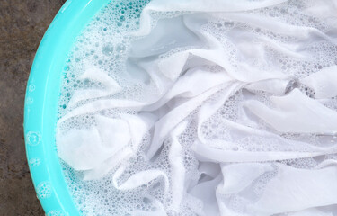 Soak a cloth before washing, white cloth