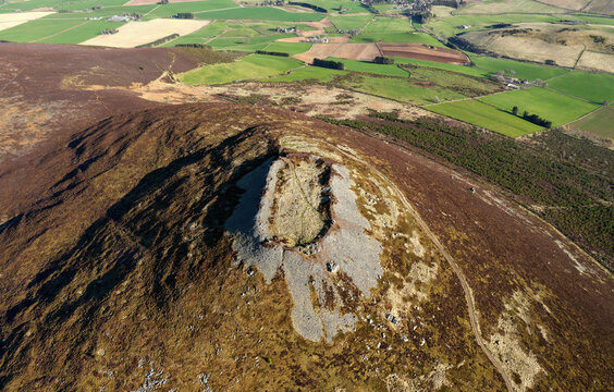 Tap o&rsquo; Noth prehistoric hillfort Grampian, Scotland. Massive vitrified wall of Neolithic core. Outer rampart encloses large early Medieval settlement