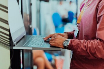 Close up of business hands are typing on laptop.