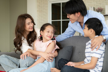 A boy and a daughter from an asian family.