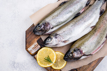 Raw uncooked trout with lemon
