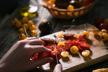 Various selection of tomatoes, brown, yellow, red and green. Sorted and arranged for baking.