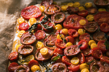 Various selection of tomatoes, brown, yellow, red and green. Sorted and arranged for baking.