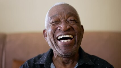 One joyful Senior Black Brazilian man smiling and laughing at camera. Friendly charismatic African American elderly person