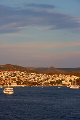 Small picturesque town Hvar on island Hvar, Croatia, illuminated by warm sunset light.