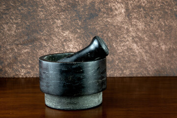 Stoneware Pestle and Mortar on a Wooden Shelf
