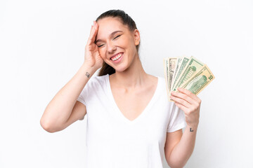Young caucasian woman taking a lot of money isolated on white background smiling a lot
