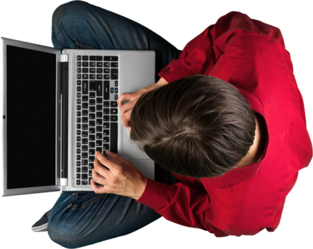 Portrait of young man in red shirt using laptop isolated on white background