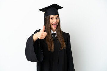 Young university graduate isolated on white background with thumbs up because something good has happened