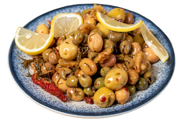 Special mixed olives prepared with green olives, dried red peppers, sun-dried tomatoes, thyme, walnuts and rosemary. Mixed olives with special sauce isolated on white background. close up