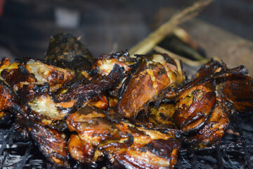 Close up portrait of burning catfish. It looks so delicious.