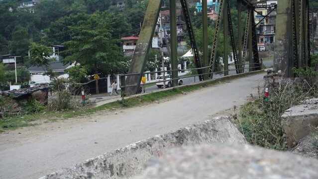 october 14th 2022, Dehradun City, Uttarakhand, India. Indian Colorful goats feeding on roadside grass.