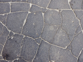 Obraz premium Old cracked asphalt surface. Background or texture. 