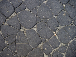 Old cracked asphalt surface. Background or texture.   