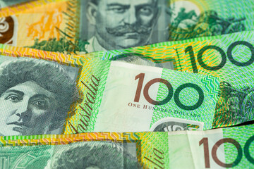 Green australian one hundred dollar notes in cash