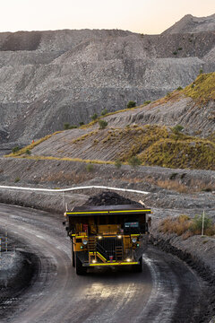 Open cut coal mine site with big machinery working