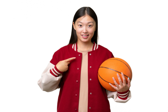 Young basketball player asian woman over isolated background with surprise facial expression