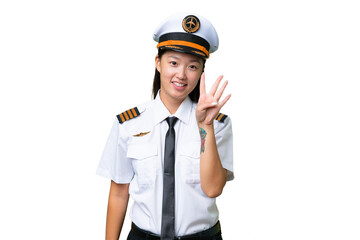 Airplane pilot Asian woman over isolated background happy and counting four with fingers