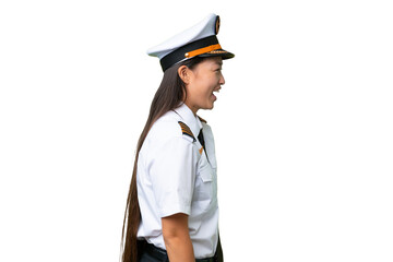 Airplane pilot Asian woman over isolated background laughing in lateral position