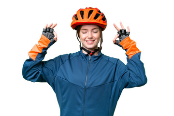 Young cyclist woman over isolated chroma key background in zen pose - obrazy, fototapety, plakaty