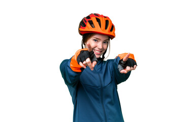 Young cyclist woman over isolated chroma key background points finger at you while smiling