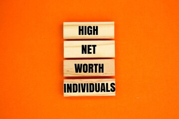 Obraz premium wooden arrangement with the words High Net Worth Individuals. all HNWIs will have to review their inheritance plans